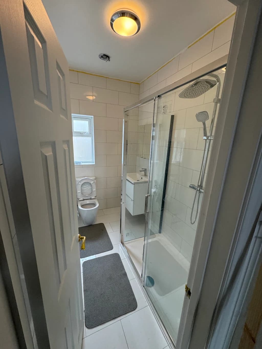 Luxury walk-in shower installation with white tiles - Wet room fitters Croydon