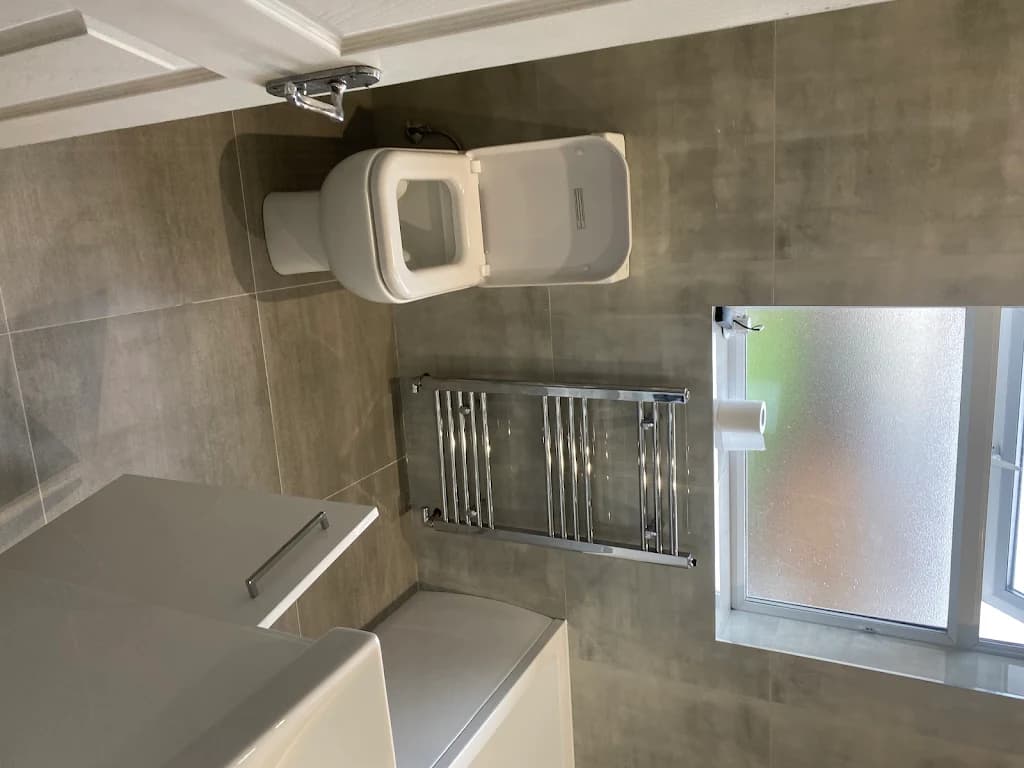 Modern toilet fitting with chrome towel radiator - Bathroom refurbishment Mitcham
