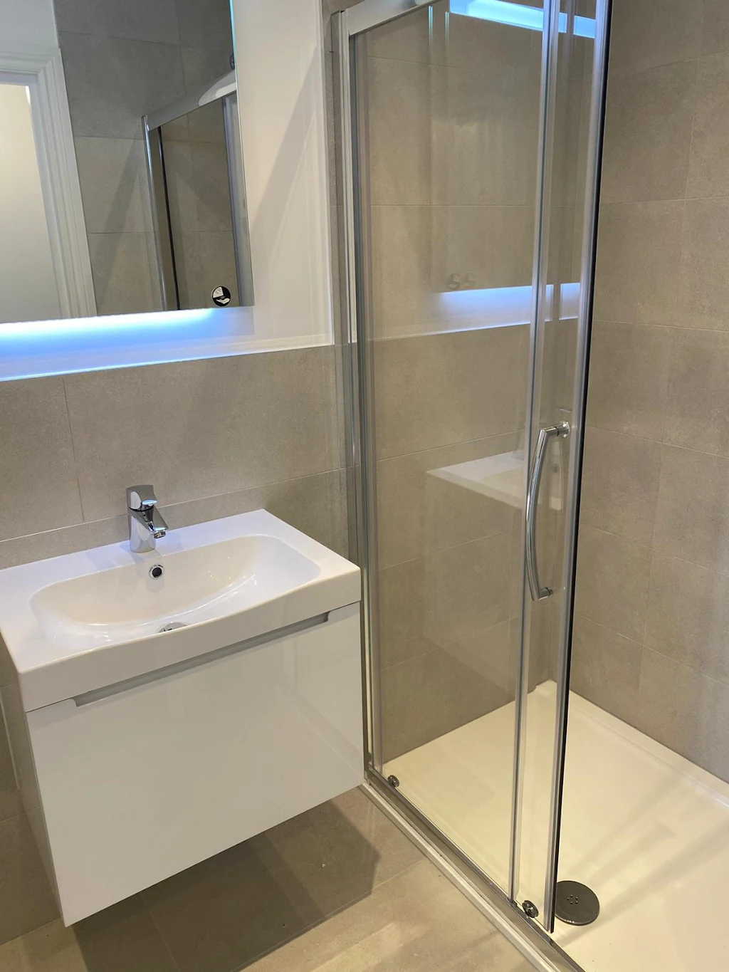 Modern Bathroom Renovation with White Vanity Unit - Fredi Builders